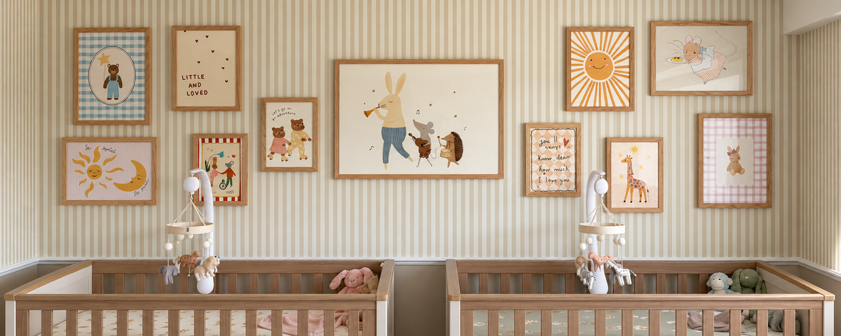 Wallify nursery gallery with natural wood framed prints